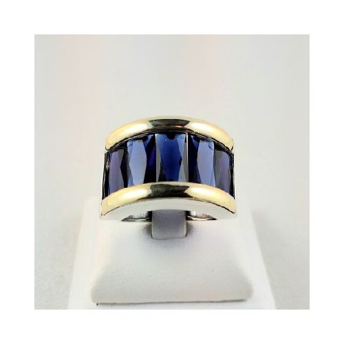 Anillo de plata 925 y double en oro 18 ktes con circonia color azul. Diámetro interno 17 mm y 18 mm.